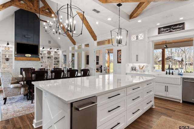 kitchen with a center island, dishwasher, white cabinets, and high vaulted ceiling