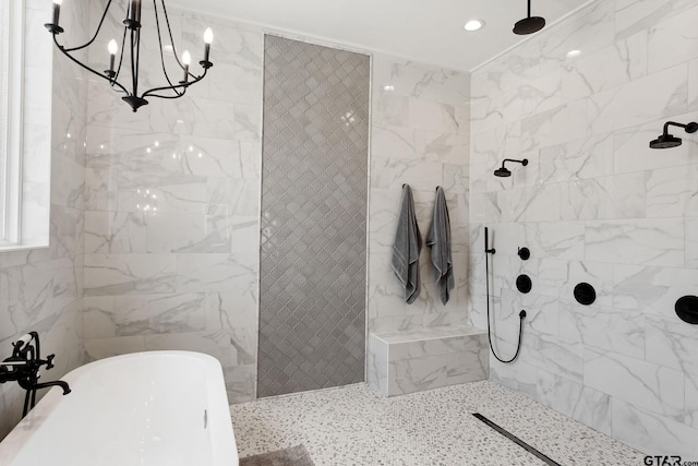 bathroom featuring a chandelier and independent shower and bath