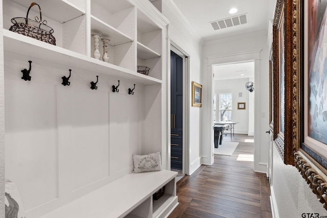 mudroom featuring crown molding and dark hardwood / wood-style flooring