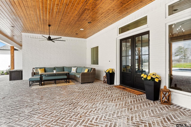 view of patio / terrace featuring outdoor lounge area, ceiling fan, and french doors