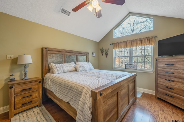 bedroom featuring ceiling fan, lofted ceiling, and hardwood / wood-style floors