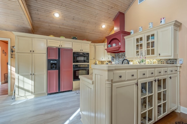 kitchen with wooden ceiling, tasteful backsplash, light wood-type flooring, paneled built in fridge, and oven