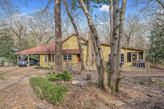 view of front of property with a carport