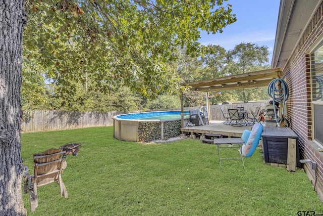 view of yard featuring a swimming pool side deck