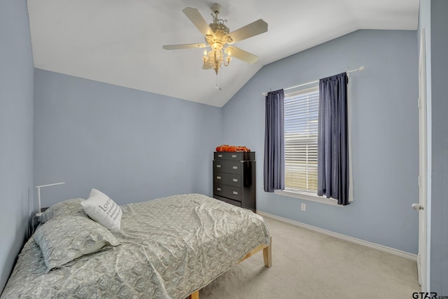 bedroom with carpet floors, vaulted ceiling, and ceiling fan