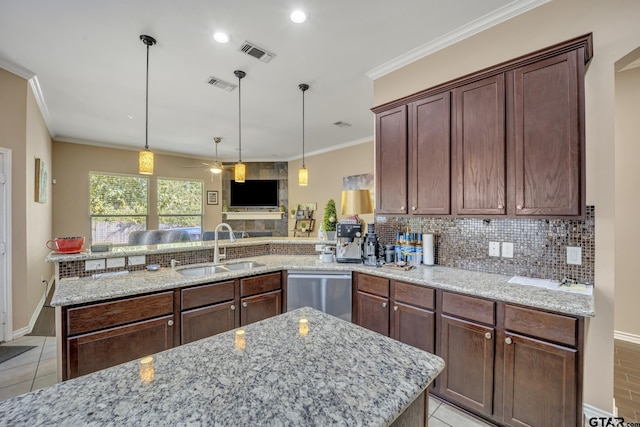 kitchen with ceiling fan, sink, light stone counters, stainless steel dishwasher, and kitchen peninsula