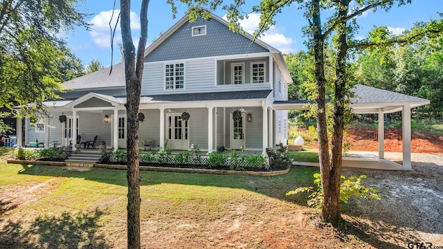 view of front of home with a porch and a front yard