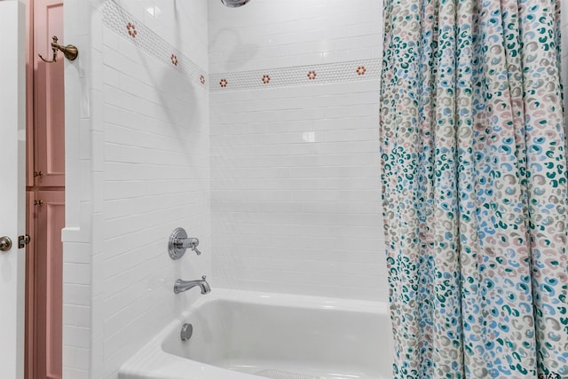 bathroom featuring shower / tub combo with curtain