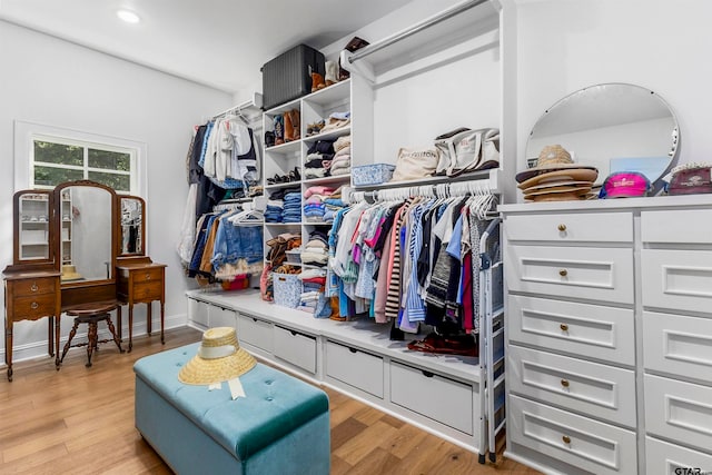 walk in closet featuring light hardwood / wood-style flooring