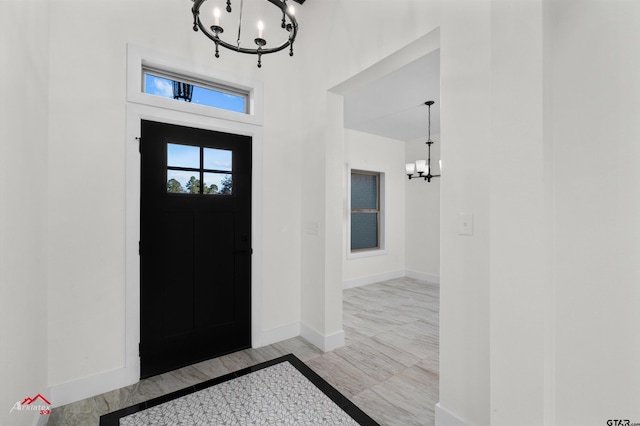 entrance foyer featuring a chandelier