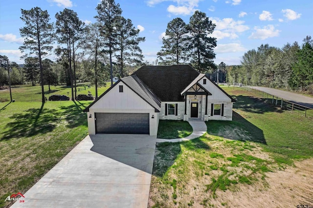 modern inspired farmhouse featuring a garage and a front lawn