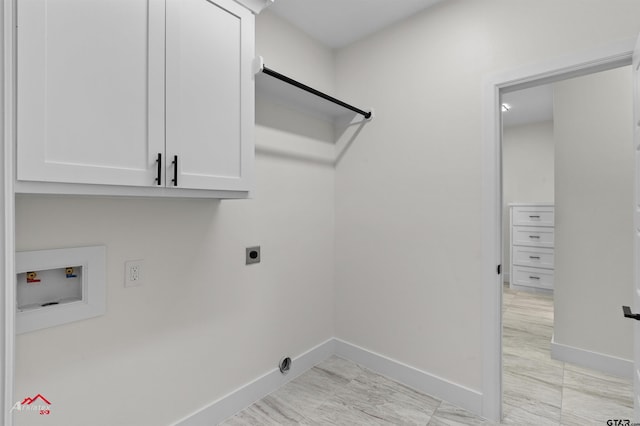 laundry area with cabinets, hookup for an electric dryer, and hookup for a washing machine