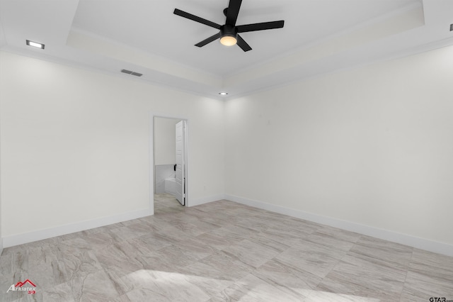 unfurnished room with ornamental molding, a raised ceiling, and ceiling fan