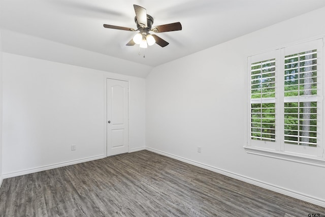 unfurnished room with baseboards, wood finished floors, and a ceiling fan