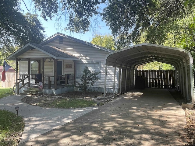 761 S Pacific, Canton, TX 75103 - view of front of home featuring covered porch, a detached carport, and driveway