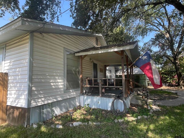 back of house with a porch