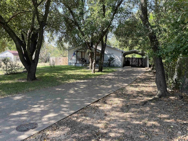761 S Pacific, Canton, TX 75103 - view of front of house featuring a detached carport and concrete driveway
