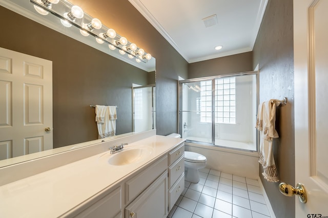 full bathroom with vanity, tile patterned floors, crown molding, toilet, and enclosed tub / shower combo