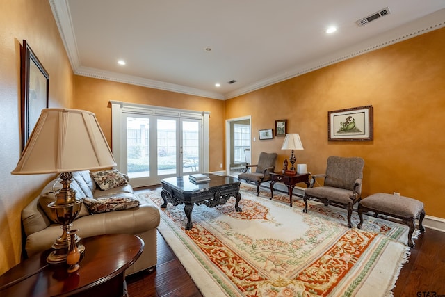 living room featuring dark hardwood / wood-style flooring and ornamental molding