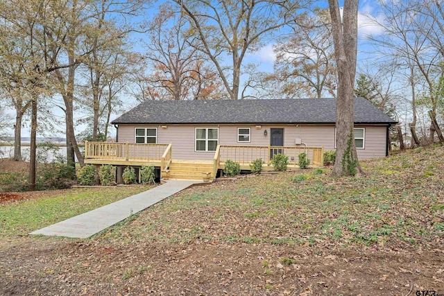 view of front of home featuring a wooden deck