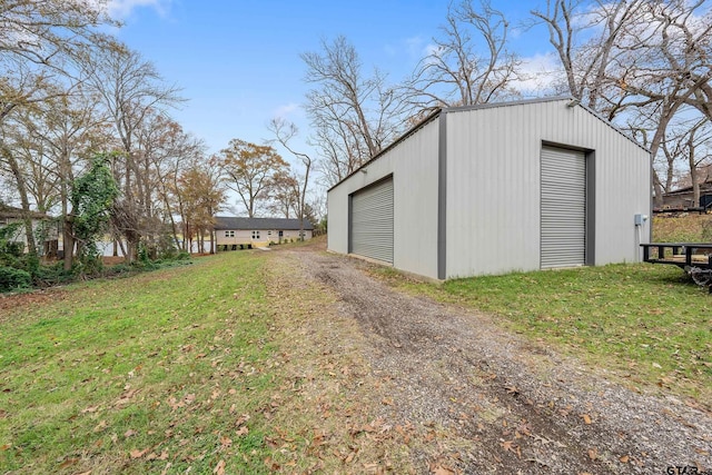 garage featuring a yard