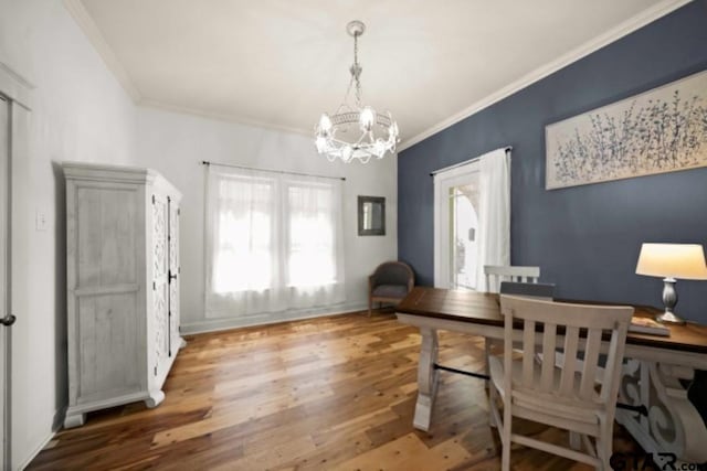 office area with an inviting chandelier, wood-type flooring, and ornamental molding