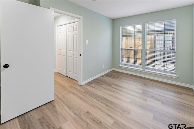 unfurnished room featuring light hardwood / wood-style floors