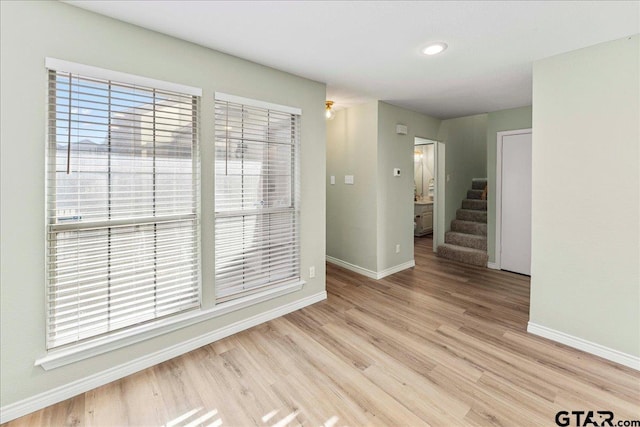 unfurnished room featuring light wood-type flooring