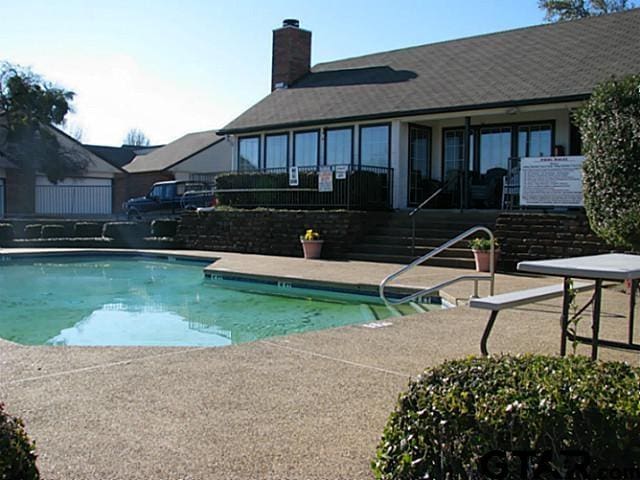 view of pool featuring a patio area