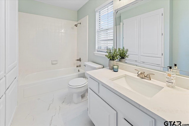 full bathroom with tiled shower / bath combo, vanity, and toilet