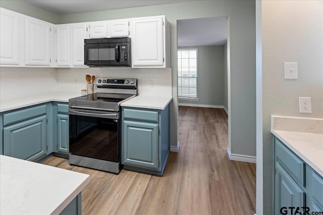 kitchen with white cabinetry, decorative backsplash, blue cabinetry, light wood-type flooring, and stainless steel electric range