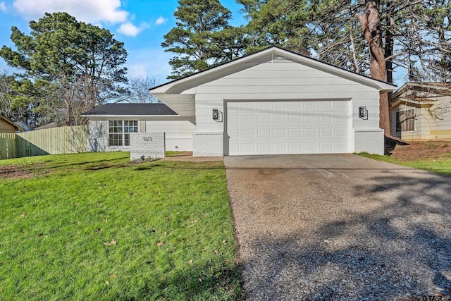 single story home with a garage and a front lawn