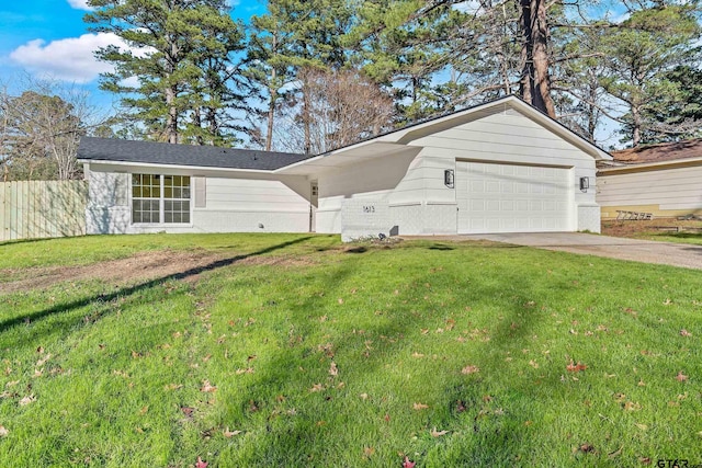 ranch-style house featuring a front yard and a garage