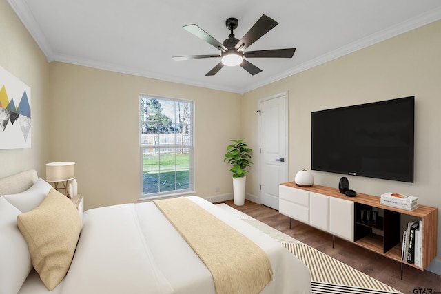 bedroom with ceiling fan, dark hardwood / wood-style floors, and crown molding