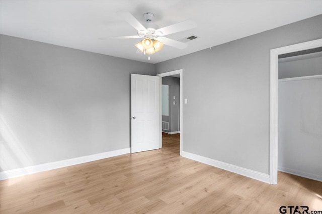 106 Peterson Pl, Longview, TX 75602 - unfurnished bedroom featuring light wood-style flooring, a closet, and a ceiling fan