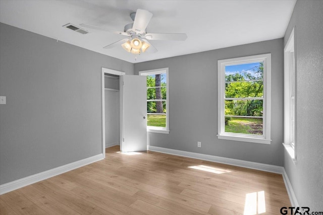 106 Peterson Pl, Longview, TX 75602 - unfurnished bedroom featuring light wood-type flooring, a closet, and a ceiling fan