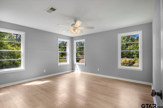 106 Peterson Pl, Longview, TX 75602 - spare room with a ceiling fan and light wood finished floors