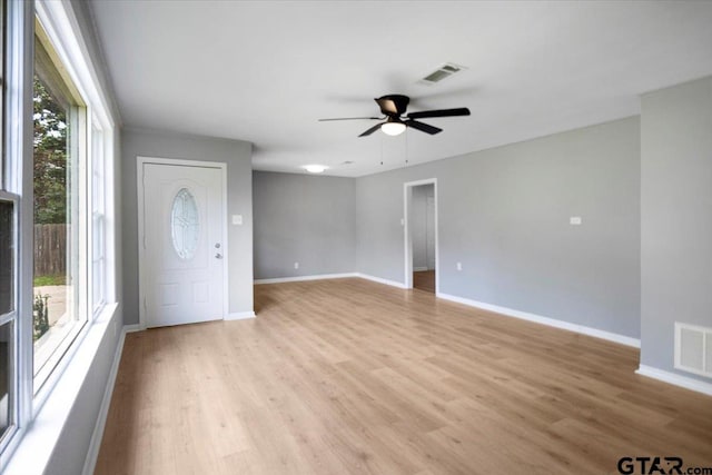 106 Peterson Pl, Longview, TX 75602 - empty room with plenty of natural light, light wood-type flooring, and ceiling fan
