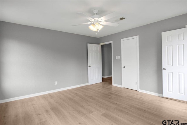 106 Peterson Pl, Longview, TX 75602 - unfurnished bedroom with light wood finished floors and a ceiling fan