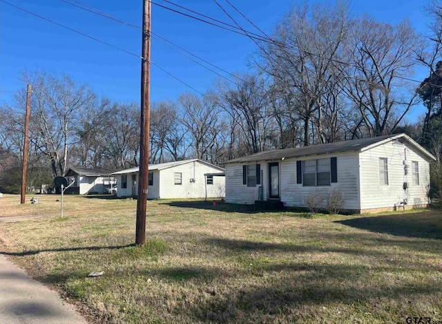 7094 Eleanor St, Tyler, TX 75708 - view of front of house with a front lawn