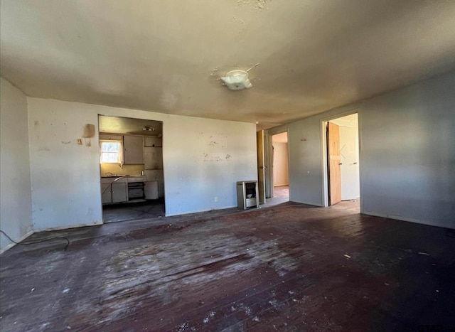 7094 Eleanor St, Tyler, TX 75708 - unfurnished living room with wood-type flooring