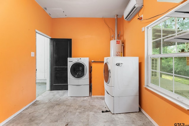 2811 Rollingwood Dr, Tyler, TX 75701 - laundry area featuring a wall mounted air conditioner, washer and dryer, water heater, and plenty of natural light