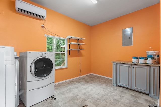 2811 Rollingwood Dr, Tyler, TX 75701 - laundry room featuring a wall unit AC, electric panel, washer and dryer, cabinet space, and baseboards