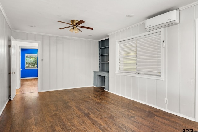 2811 Rollingwood Dr, Tyler, TX 75701 - empty room featuring an AC wall unit, crown molding, wood-type flooring, ceiling fan, and baseboards