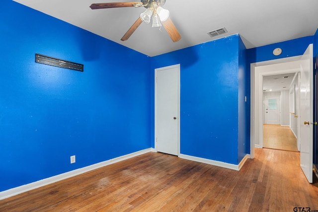 2811 Rollingwood Dr, Tyler, TX 75701 - unfurnished bedroom featuring baseboards, hardwood / wood-style floors, a closet, and ceiling fan