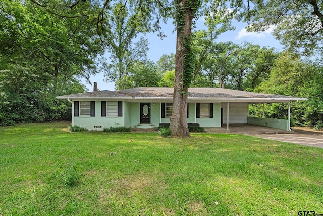 2811 Rollingwood Dr, Tyler, TX 75701 - single story home featuring driveway, a front yard, a carport, and a chimney