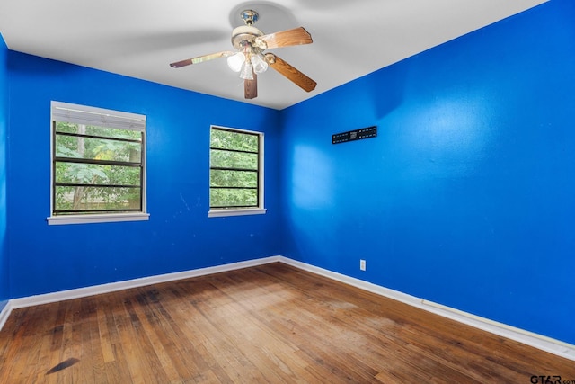 2811 Rollingwood Dr, Tyler, TX 75701 - spare room with a ceiling fan, baseboards, and wood-type flooring