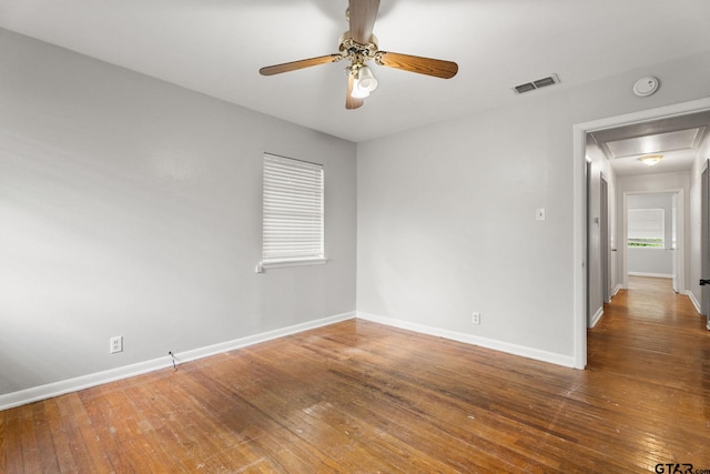 2811 Rollingwood Dr, Tyler, TX 75701 - unfurnished room with attic access, a ceiling fan, hardwood / wood-style flooring, baseboards, and a smoke detector
