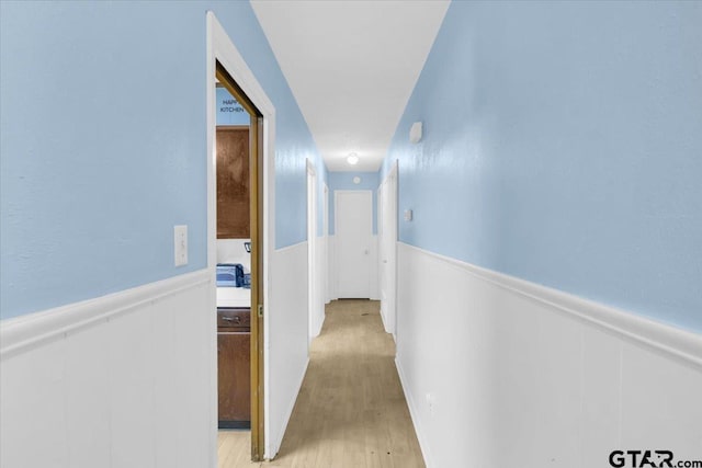 corridor featuring light hardwood / wood-style floors