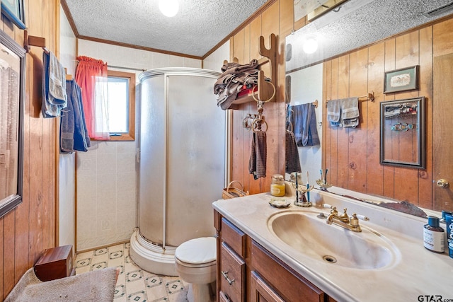 bathroom with crown molding, a shower with door, and wooden walls